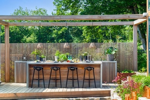 outdoor kitchen with pendant lighting