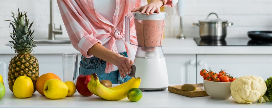 woman mixing smoothie