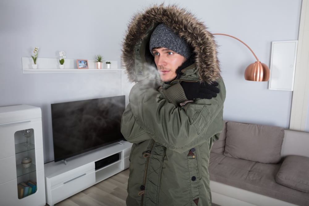 man wearing parka inside