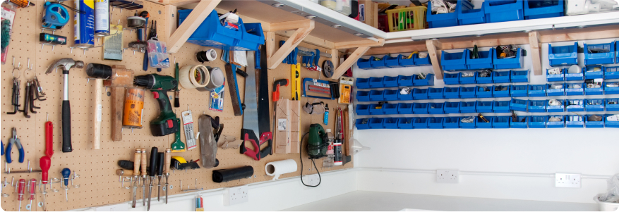 A pegboard with various tools mounted.